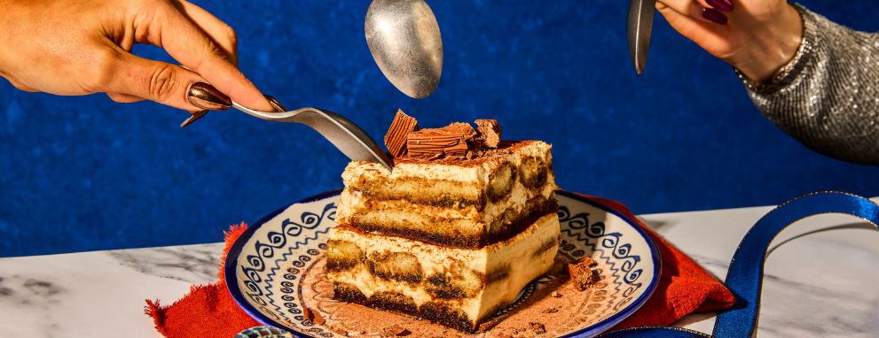 People eating tiramisu