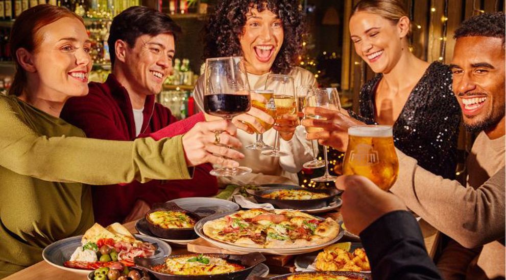 Friends cheersing at a Bottomless Brunch